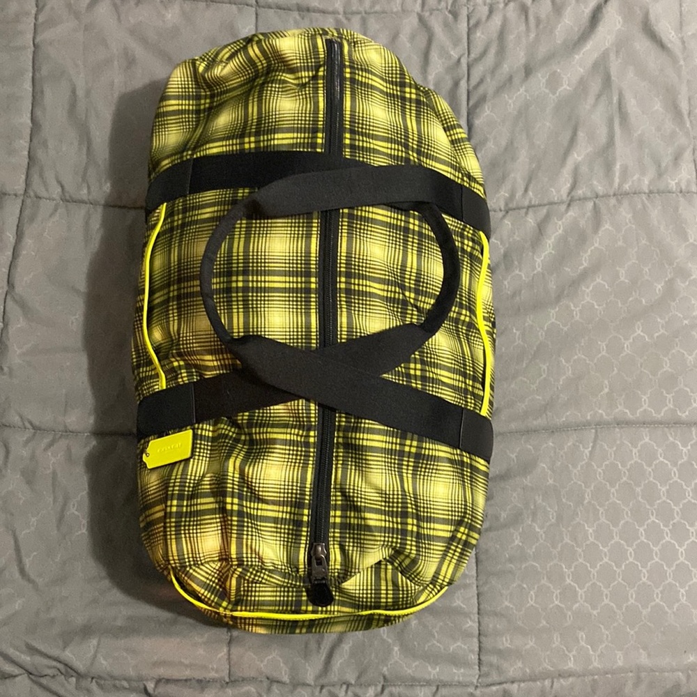 Packable duffel bag | Coach. Neon yellow/multi black plaid
